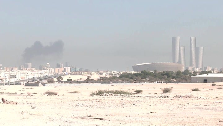 Footage shows the roof of a building ablaze near the fan village called Qetaifan Island North