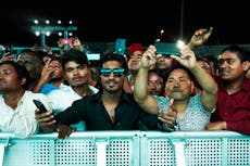 On outskirts of Doha, laborers watch World Cup they built