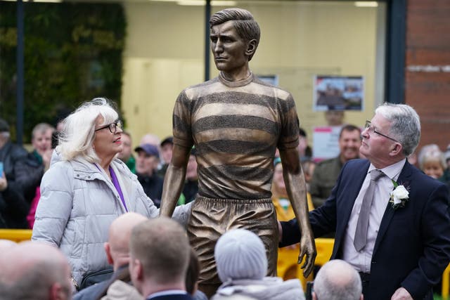 Liz McNeill beside a bronze statue of her late husband and former Celtic captain and manager Billy McNeill (Andrew Milligan/PA)