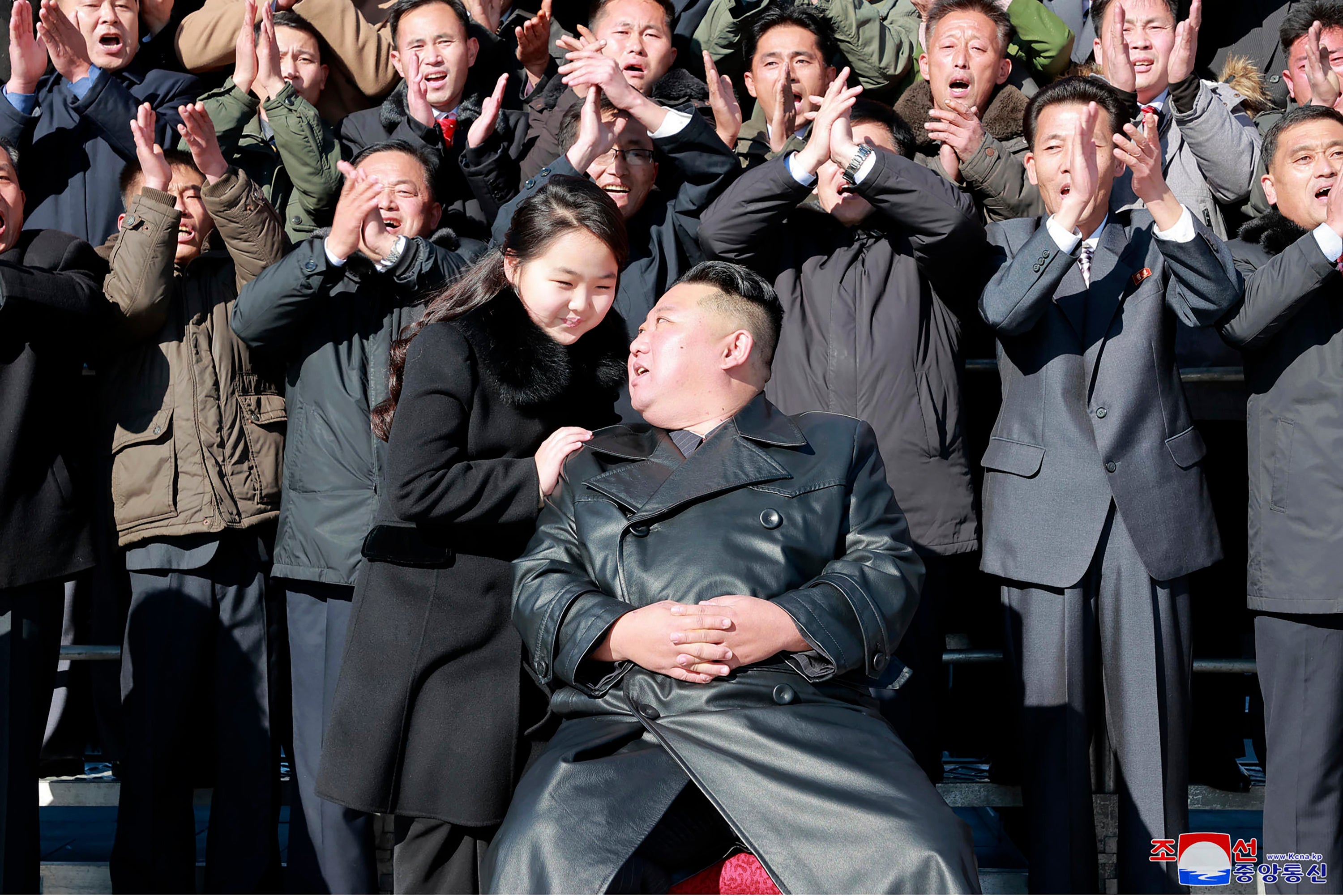 North Korean leader Kim Jong Un, center right, and his daughter, center left, with soldiers, pose for a photo, following the launch of what it says a Hwasong-17 intercontinental ballistic missile