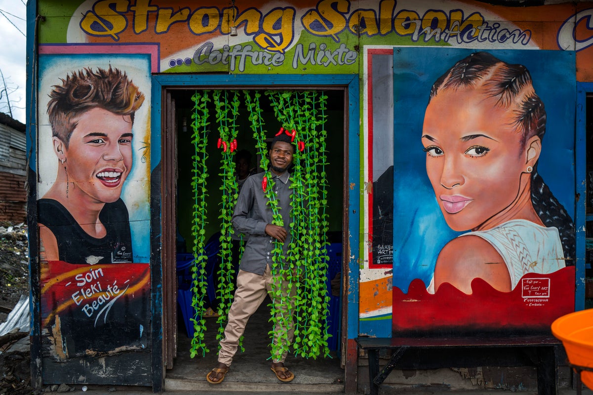 AP PHOTOS: Bright shops enliven Congo’s dark days