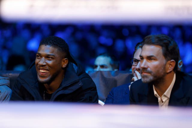 <p>Anthony Joshua and Eddie Hearn in the stands at the OVO Arena Wembley, London</p>