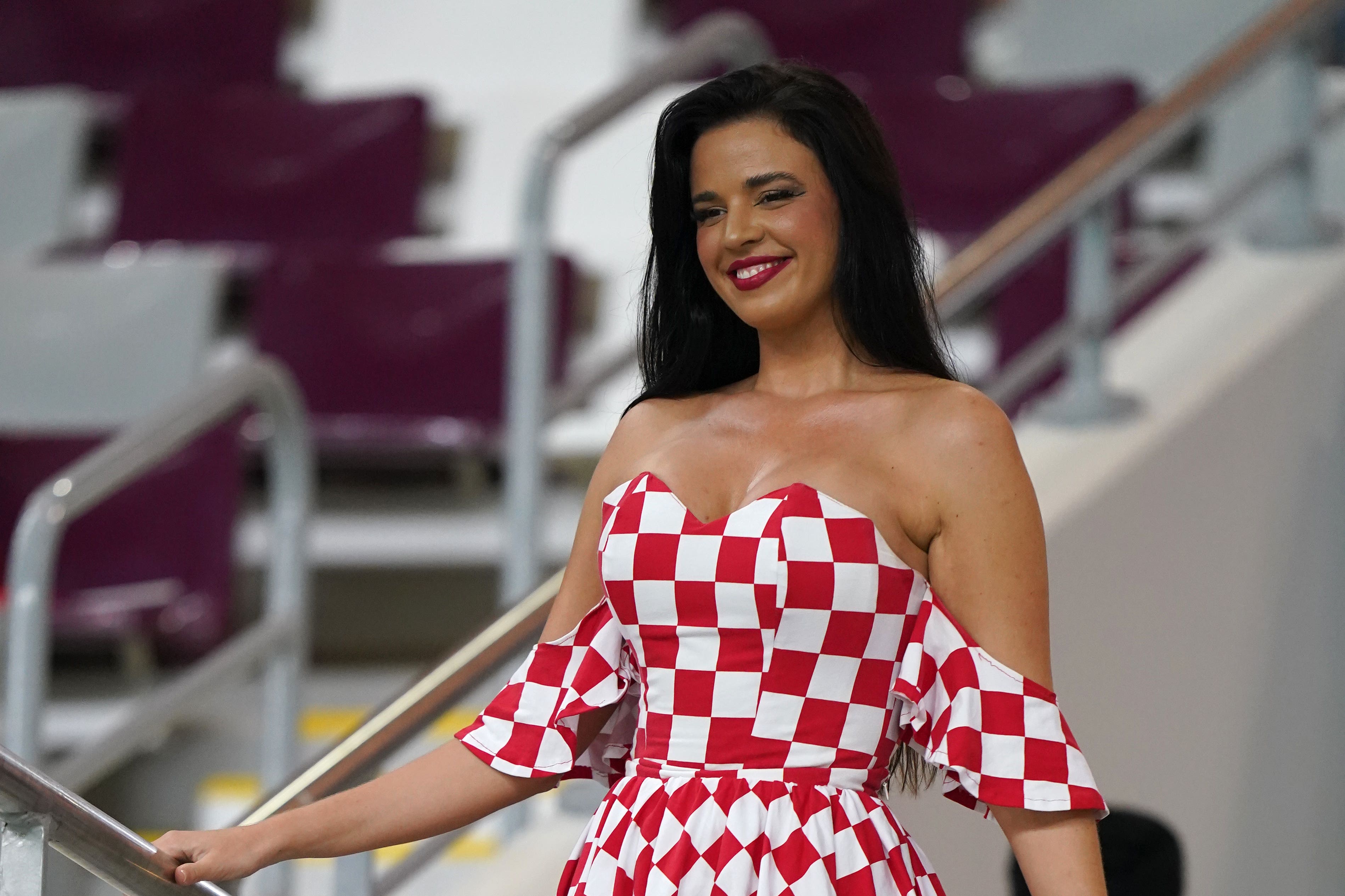 Ivana Knoll, a Croatia fan and model who has been pushing the modesty dress code of Qatar and causing a stir online is seen in the stands before the Fifa World Cup Group F match at the Khalifa International Stadium, Doha (Adam Davy/PA)