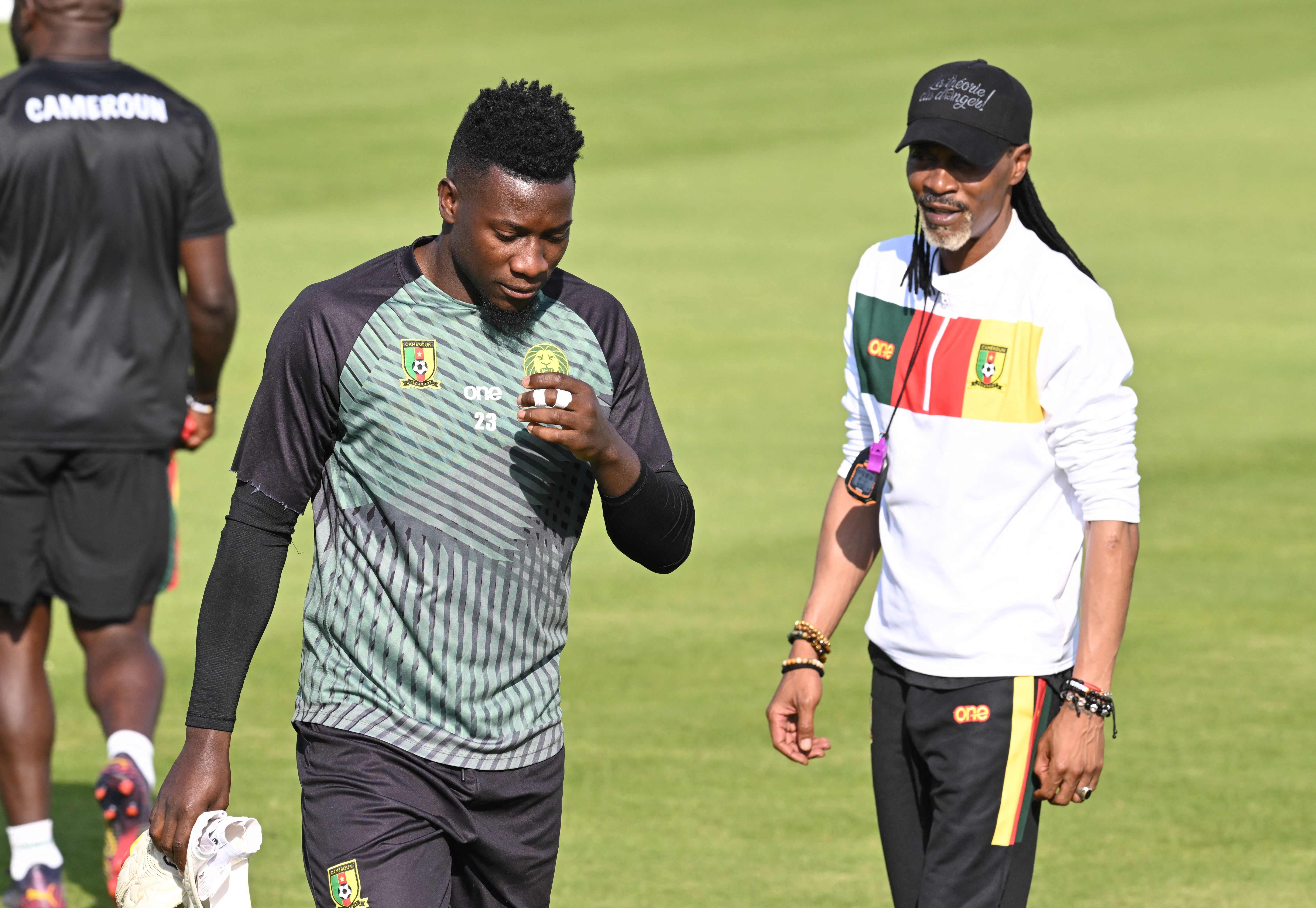 Andre Onana, left, with Cameroon manager Rigobert Song