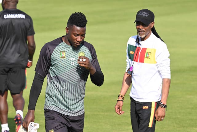 <p>Andre Onana, left, with Cameroon manager Rigobert Song</p>