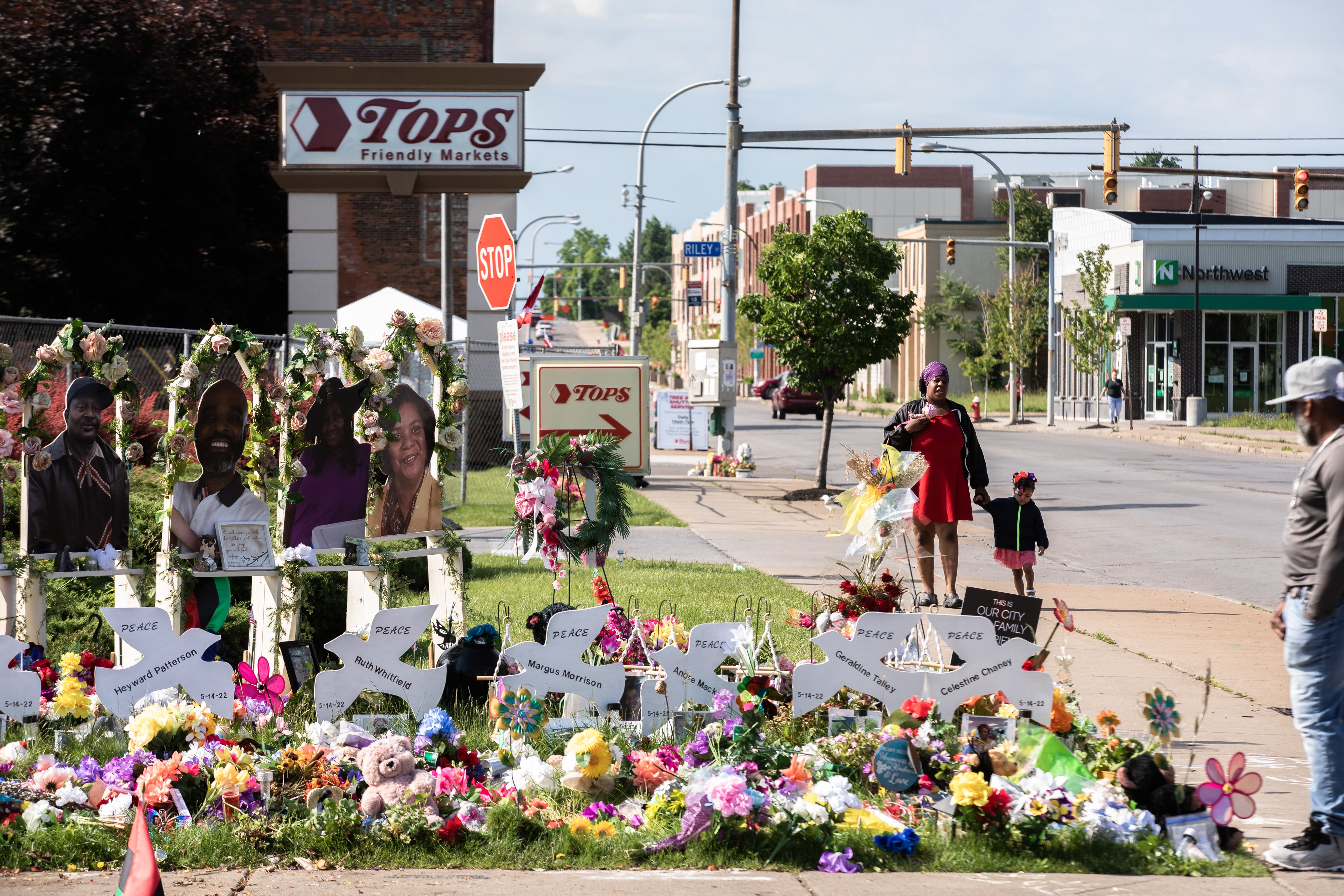 A makeshift memorial for victims of the Tops supermarket massacre recognises the 10 Black people killed in a racist attack in Buffalo, New York.
