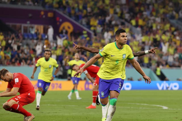 <p>Casemiro wheels away after scoring Brazil’s winner against Switzerland </p>