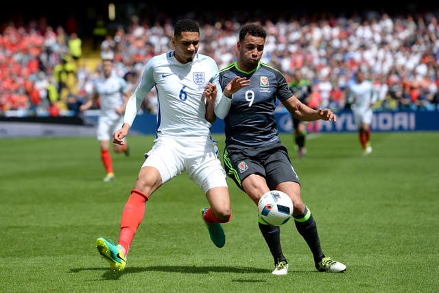 England’s Chris Smalling and Wales’ Hal Robson-Kanu, right, in their Euro 2016 contest (Joe Giddens/PA)