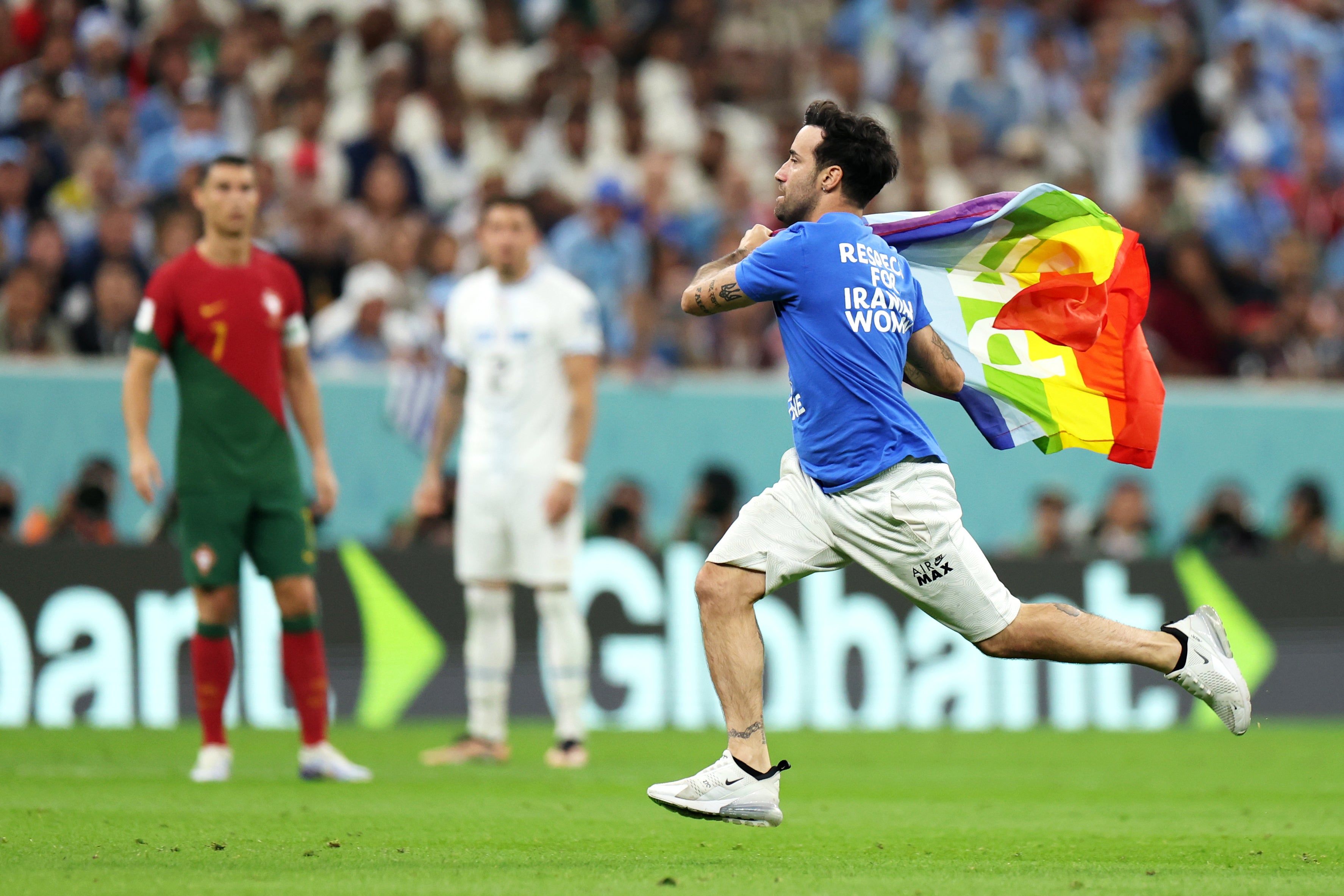 World Cup pitch invader flies rainbow flag and wears 'Save Ukraine