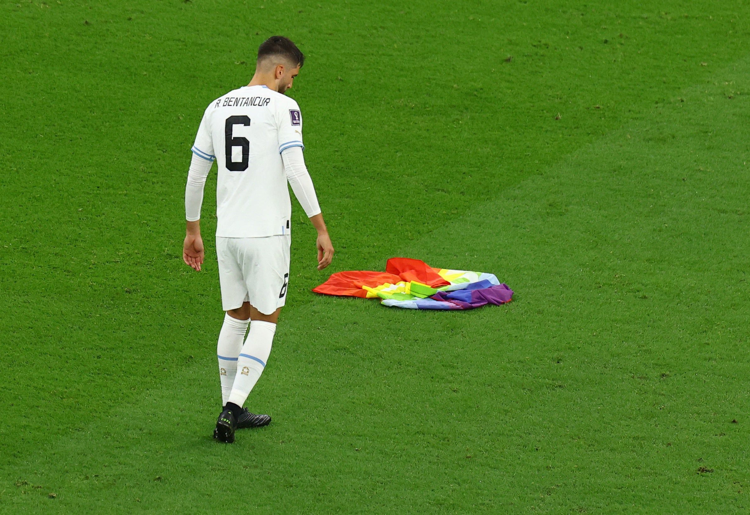 Portugal vs. Uruguay: Pitch invader with rainbow flag interrupts