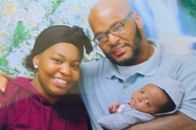 <p>Kevin Johnson, 37, with his daughter Khorry Ramey, 19, and grandchild before he was executed on Tuesday </p>