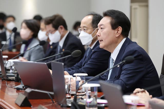 <p>File photo: South Korean president Yoon Suk Yeol (right) speaks during a cabinet meeting at the presidential office in Seoul</p>