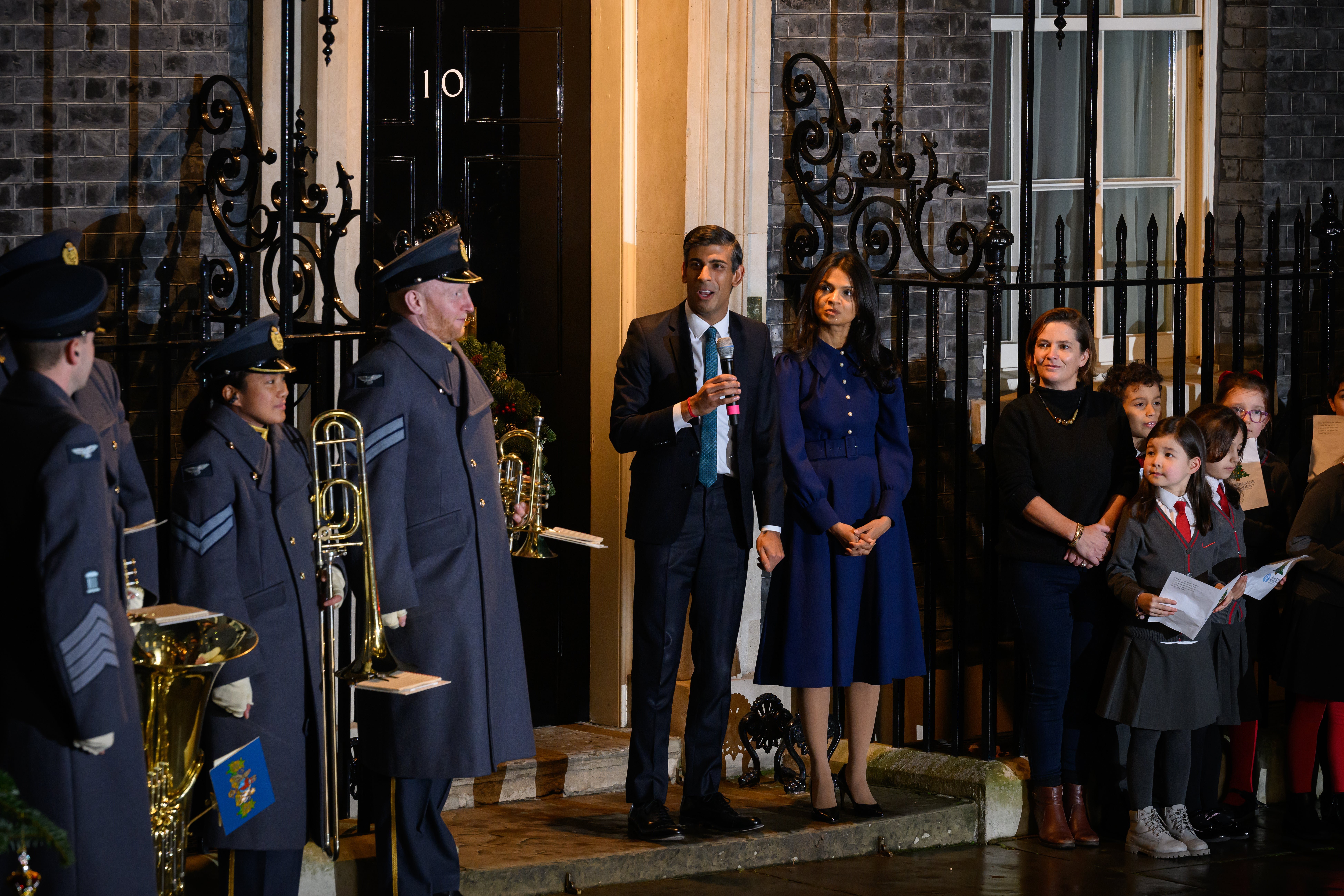 Prime minister Rishi Sunak and his wife Akshata Murthy look on as the Christmas tree lights are turned on outside No 10