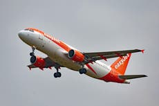 EasyJet cuts losses and insists Britons will not ditch holidays amid cost crisis
