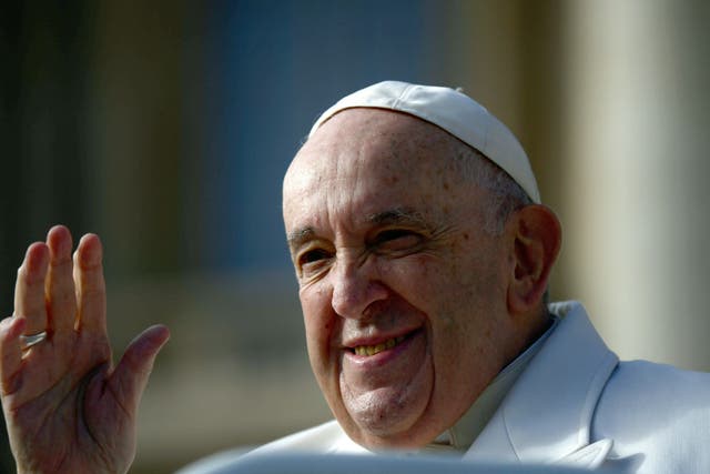 <p>Pope Francis waves to the faithful at the end of his weekly general audience in St Peter’s Square</p>