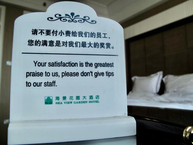 <p>Rare sign: a hotel notice in Qingdao requesting guests not to tip</p>