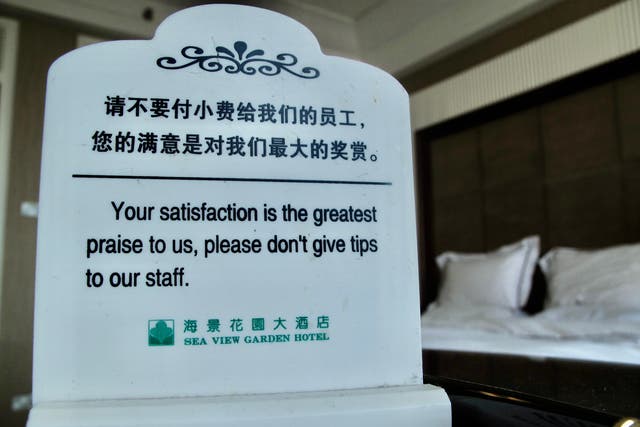 <p>Rare sign: a hotel notice in Qingdao requesting guests not to tip</p>