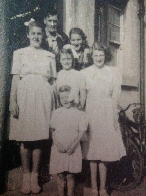 Irene Gresty (right, at front) outside her childhood home