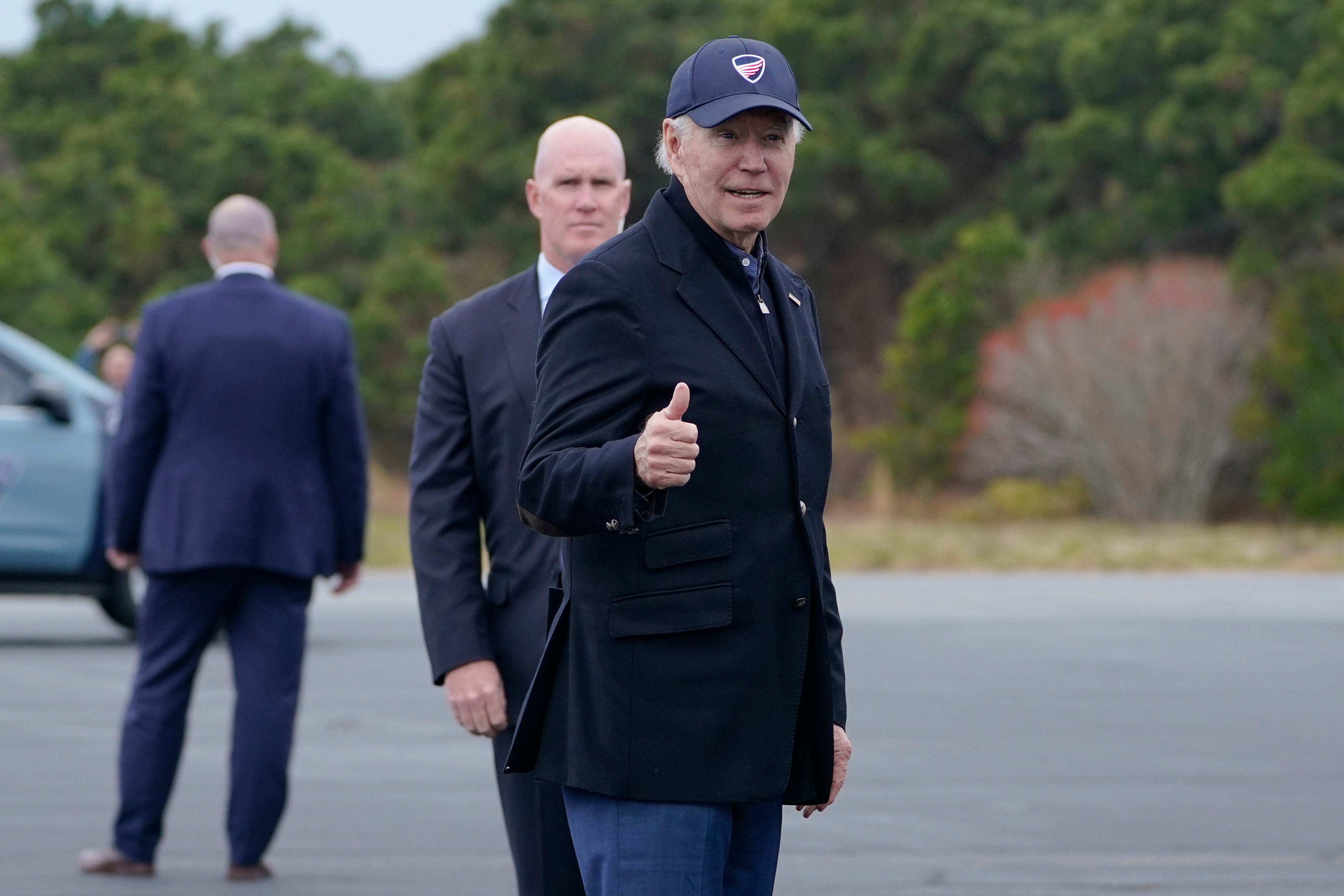 President Joe Biden gives a thumbs up before boarding Air Force One at Nantucket Memorial Airport in Nantucket, Massachusetts, on Sunday