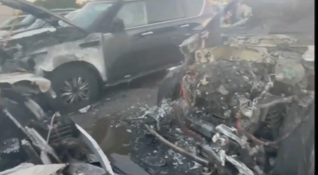 <p>The burnt out remains of vehicles rented for Joe Biden’s visit to Nantucket that burst into flames </p>