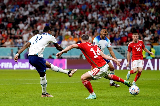Marcus Rashford scores England’s third goal against Wales and their 100th in World Cup finals tournaments (Adam Davy/PA)