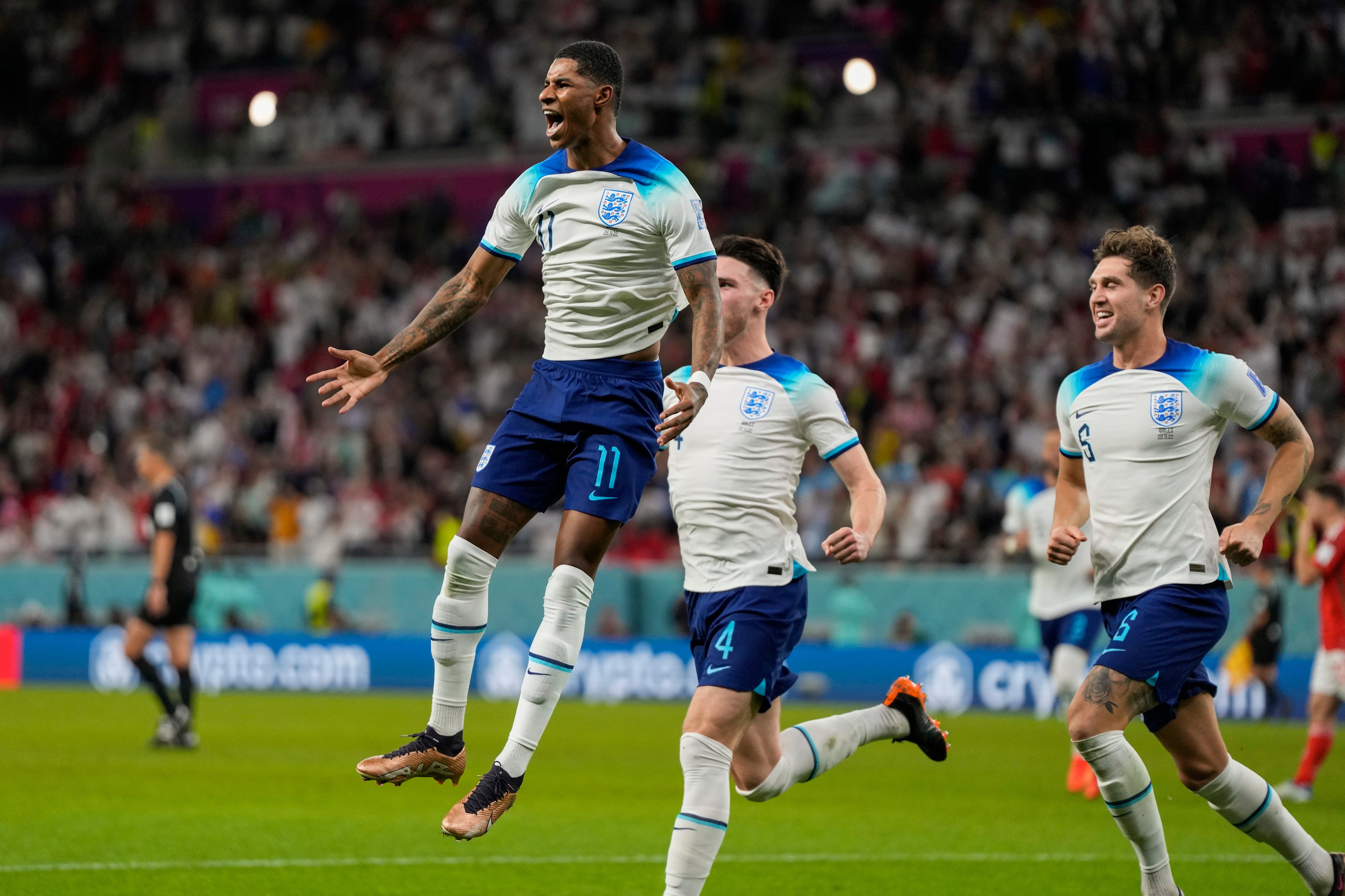 Marcus Rashford celebrates opening the scoring against Wales