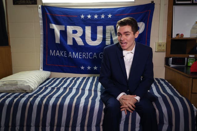 <p>White nationalist Nick Fuentes poses in his dorm room in 2016</p>