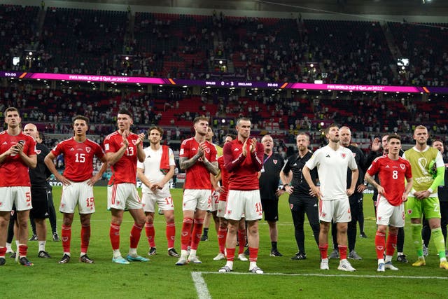 Wales captain Gareth Bale and his team-mates applaud the fans after their World Cup exit was confirmed by a 3-0 defeat to England on Tuesday (Martin Rickett/PA)