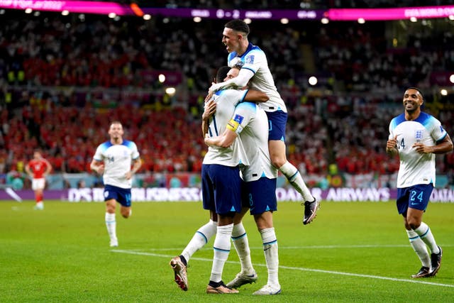 England’s Marcus Rashford is congratulated on scoring his second goal during the Fifa World Cup Group B match at the Ahmad Bin Ali Stadium, Al Rayyan, Qatar (Adam Davy/PA)