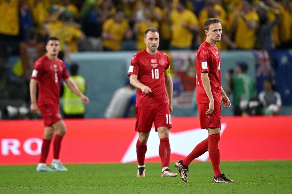 Denmark look dejected after conceding against Australia