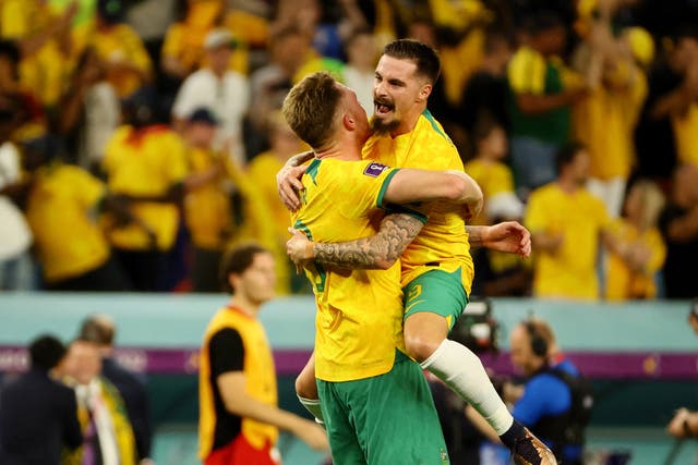 <p>Australian players celebrate their dramatic victory over Denmark</p>