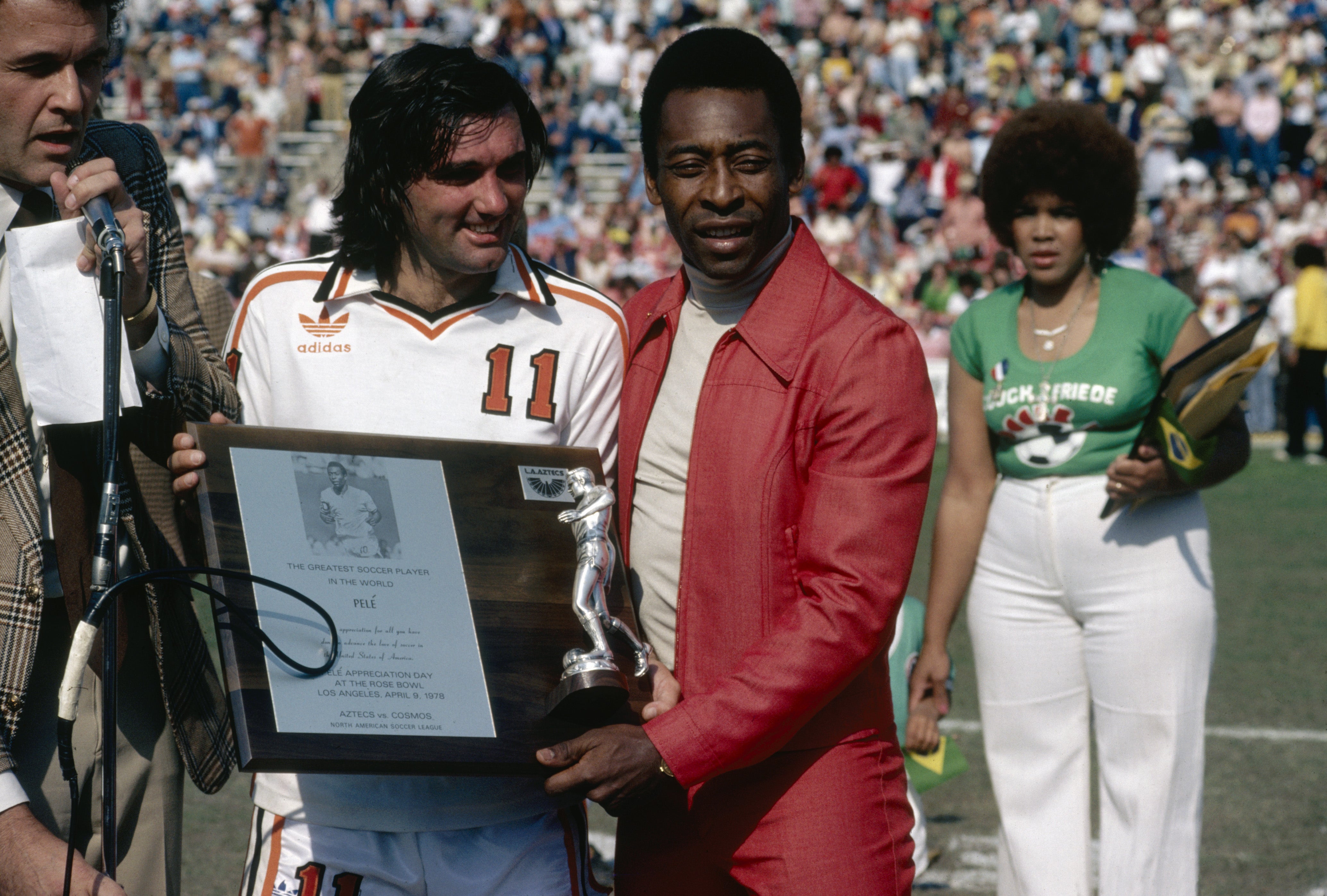 Legends of the game: George Best presents Pele with a plaque at the Rose Bowl stadium in California, 1978