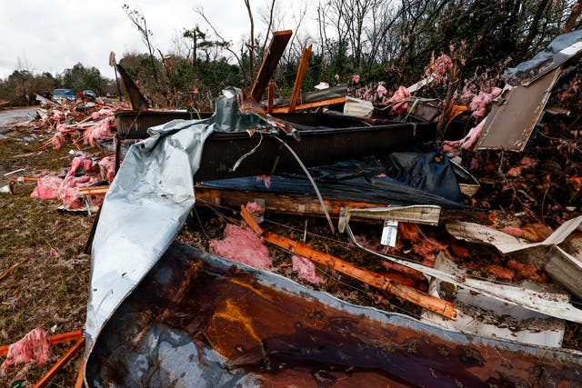 <p>Police block off roads as cleanup begins on debris from a possible tornado that left two dead Wednesday, Nov. 30, 2022, in Flatwood, Alabama</p>