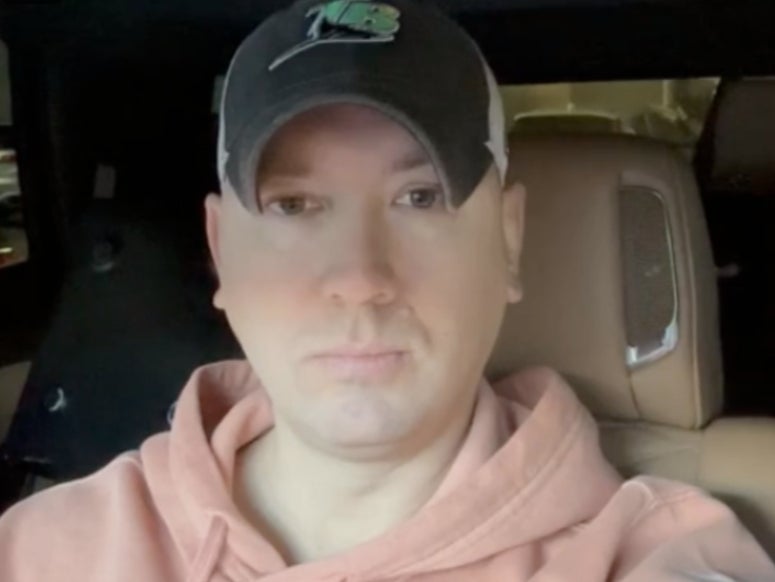Phil Godlewski, a leader in the QAnon conspiracy movement, doing a livestream from his car. Mr Godlewski pleaded guilty to corrupting a minor after allegedly having an inappropriate relationship with a 15-year-old girl