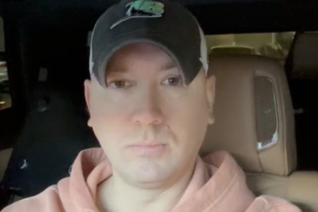 <p>Phil Godlewski, a leader in the QAnon conspiracy movement, doing a livestream from his car. Mr Godlewski pleaded guilty to corrupting a minor after allegedly having an inappropriate relationship with a 15-year-old girl</p>