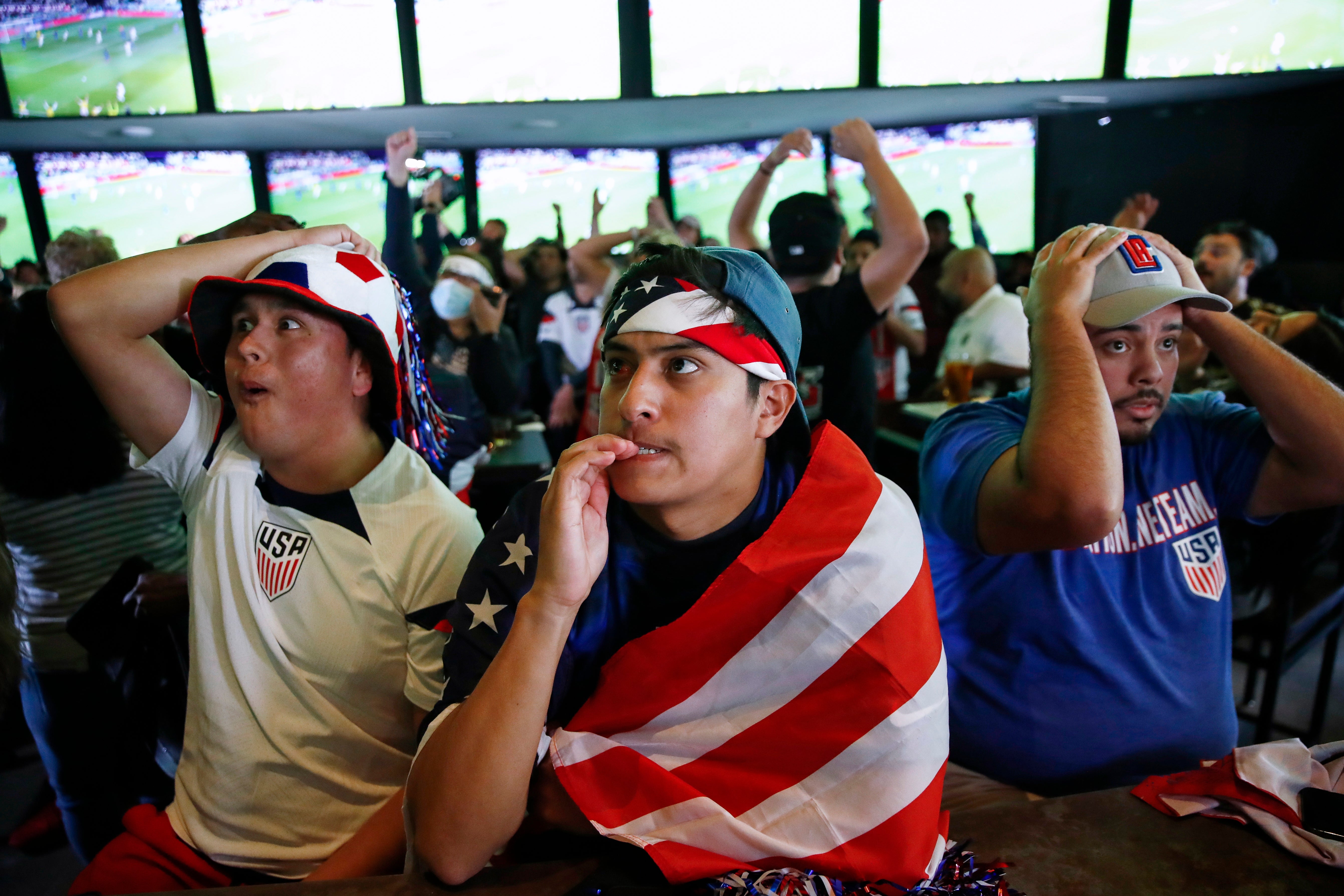 US fans react as Iran and the USA face off in the FIFA World Cup 2022 group B soccer match, at a bar in Los Angeles, California, USA,