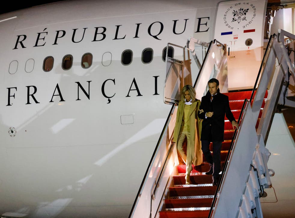 pFrench president Emmanuel Macron and his wife Brigitte Macron disembark from their plane upon arrival at Joint Base Andrews in Maryland on 29 November 2022/p