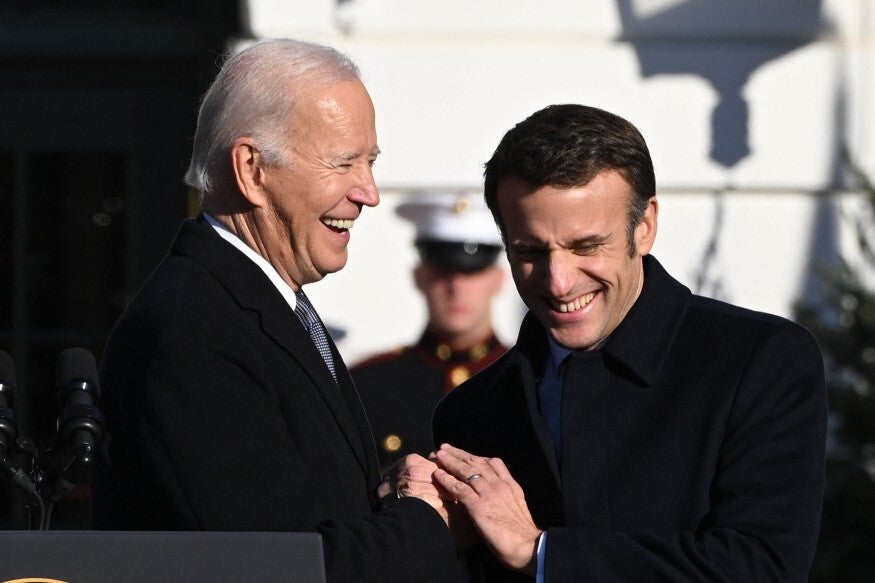 US President Joe Biden and French President Emmanuel Macron participate in an arrival ceremony for a State Visit at the White House in Washington, DC, December 1, 2022
