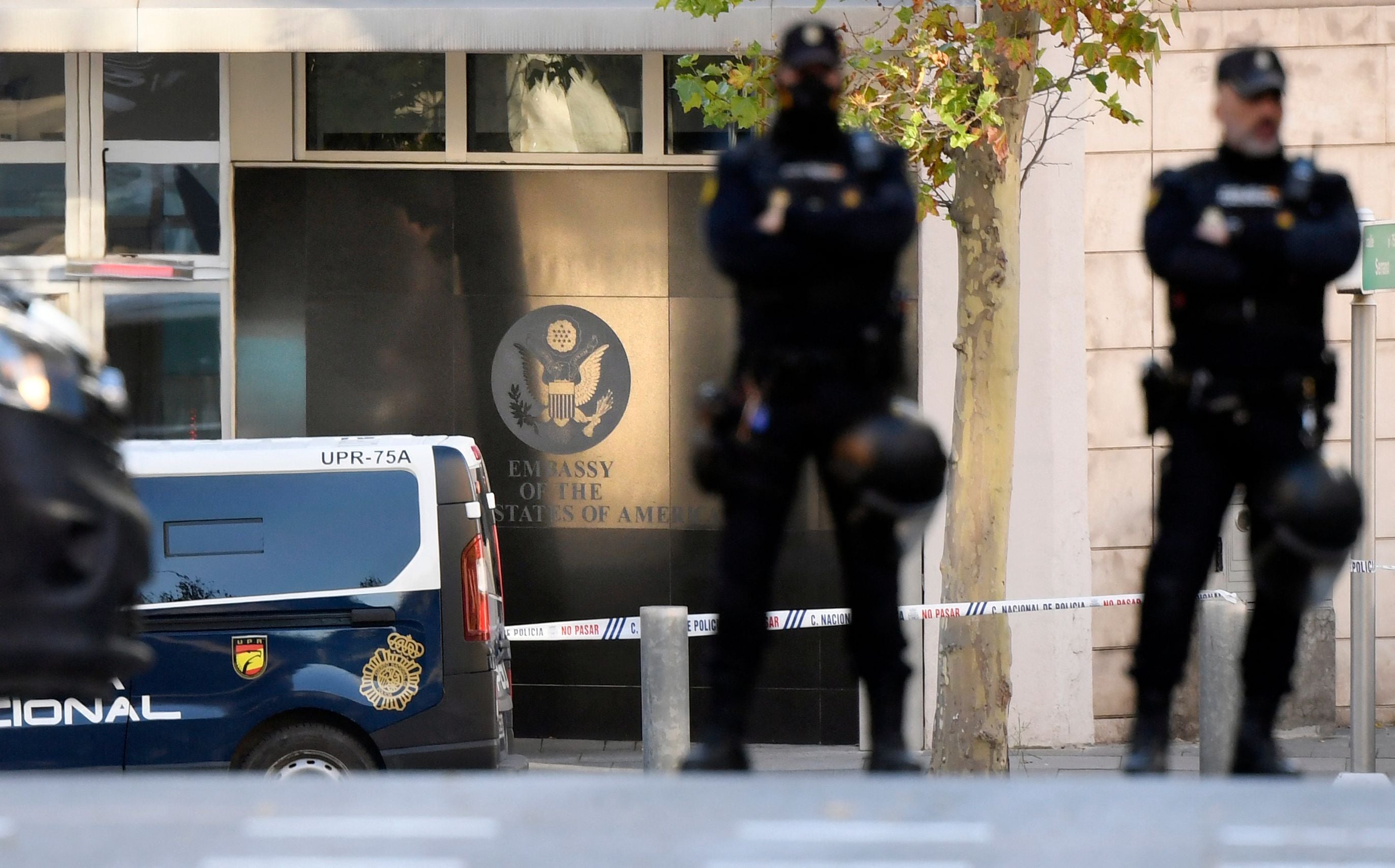 Spanish police stand guard near the US embassy in Madrid on Thursday