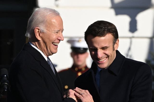 <p>US President Joe Biden and French President Emmanuel Macron participate in an arrival ceremony for a State Visit at the White House in Washington, DC, December 1, 2022</p>