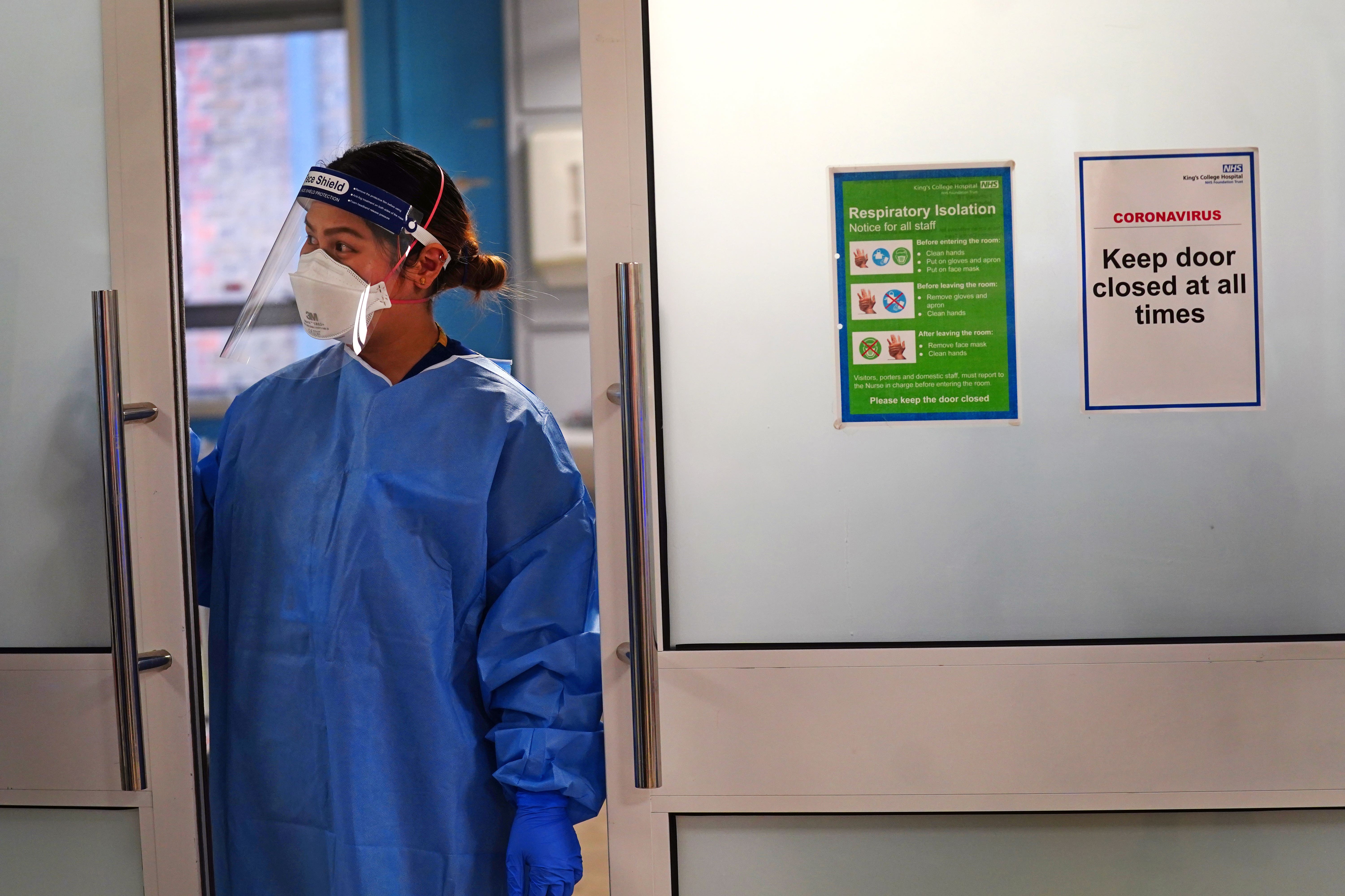 A nurse wearing full PPE on a ward for Covid-19 patients at King’s College Hospital in London (Victoria Jones/PA)