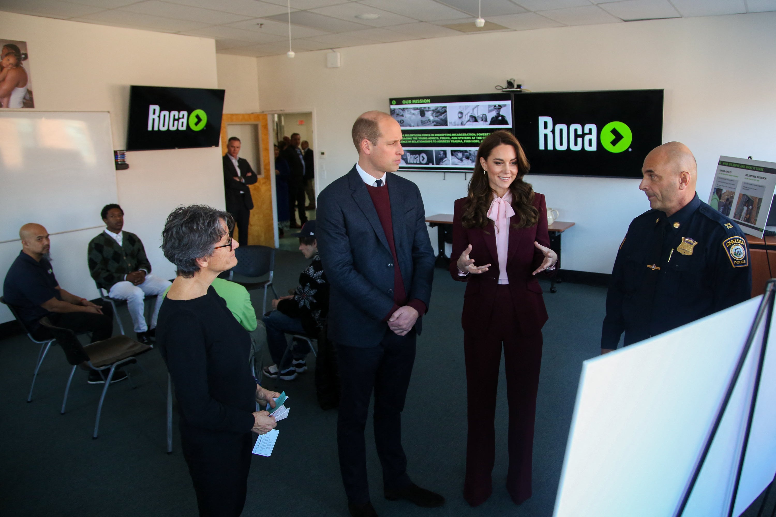 Prince William, Prince of Wales, and Catherine, Princess of Wales, meet with Molly Baldwin (L) founder of Roca and Chelsea Police Captain Dave Batchelor (R)