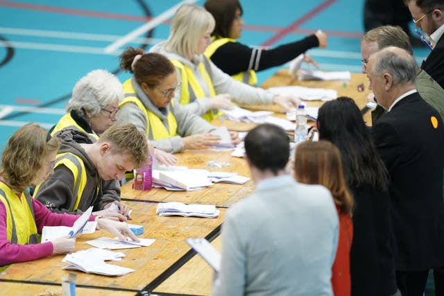 Party officials observe the count during the count at Northgate Arena Leisure Centre for the City of Chester by-election (Danny Lawson/PA)
