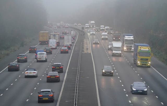 <p>Vehicles drive through fog on the M3 near Old Basing in Hampshire on Friday</p>