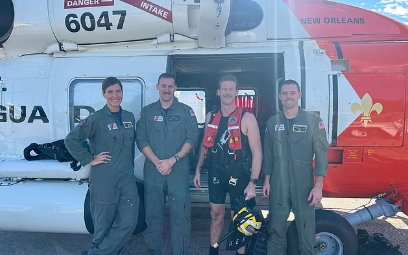 The US Coast Guard crew that rescued James Michael Grimes, 28, after he fell off a cruise ship the night before Thanksgiving. From left Lt Katy Caraway, AMT2 Dalton Goetsch, Aviation Survival Technician 2nd Class Richard ‘Dicky’ Hoefle, and Lt Travis Rhea.