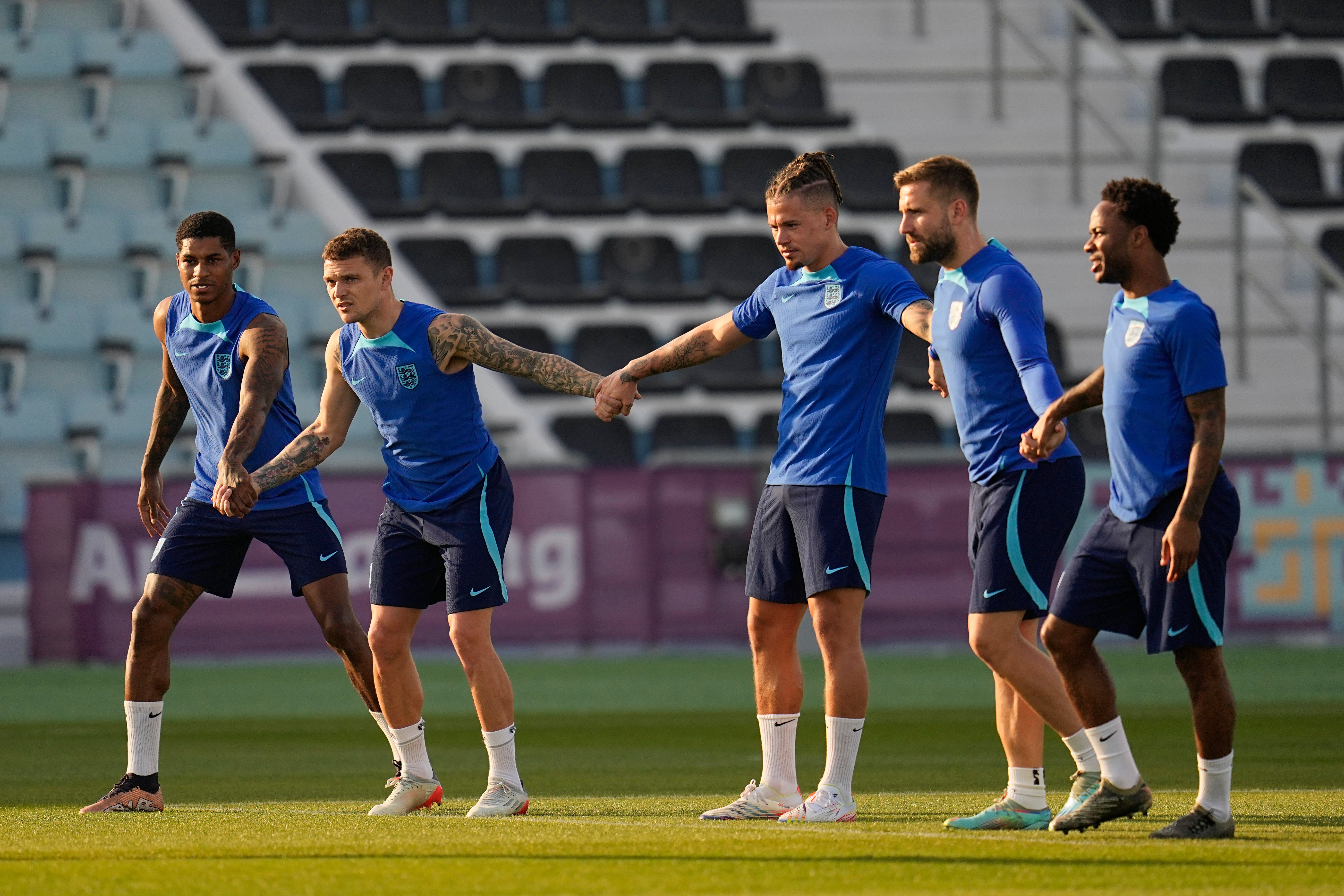 England's Marcus Rashford, Kieran Trippier, Kalvin Phillips, Luke Shaw and England's Raheem Sterling training in Qatar on Saturday