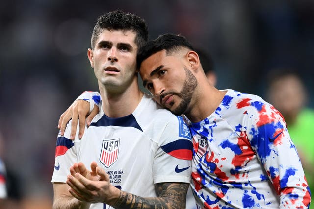 <p>Christian Pulisic and Cristian Roldan look dejected after the USA’s World Cup exit</p>