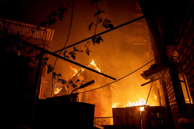 <p>A house burns after a Russian attack in Kherson, Ukraine, on 3 December </p>