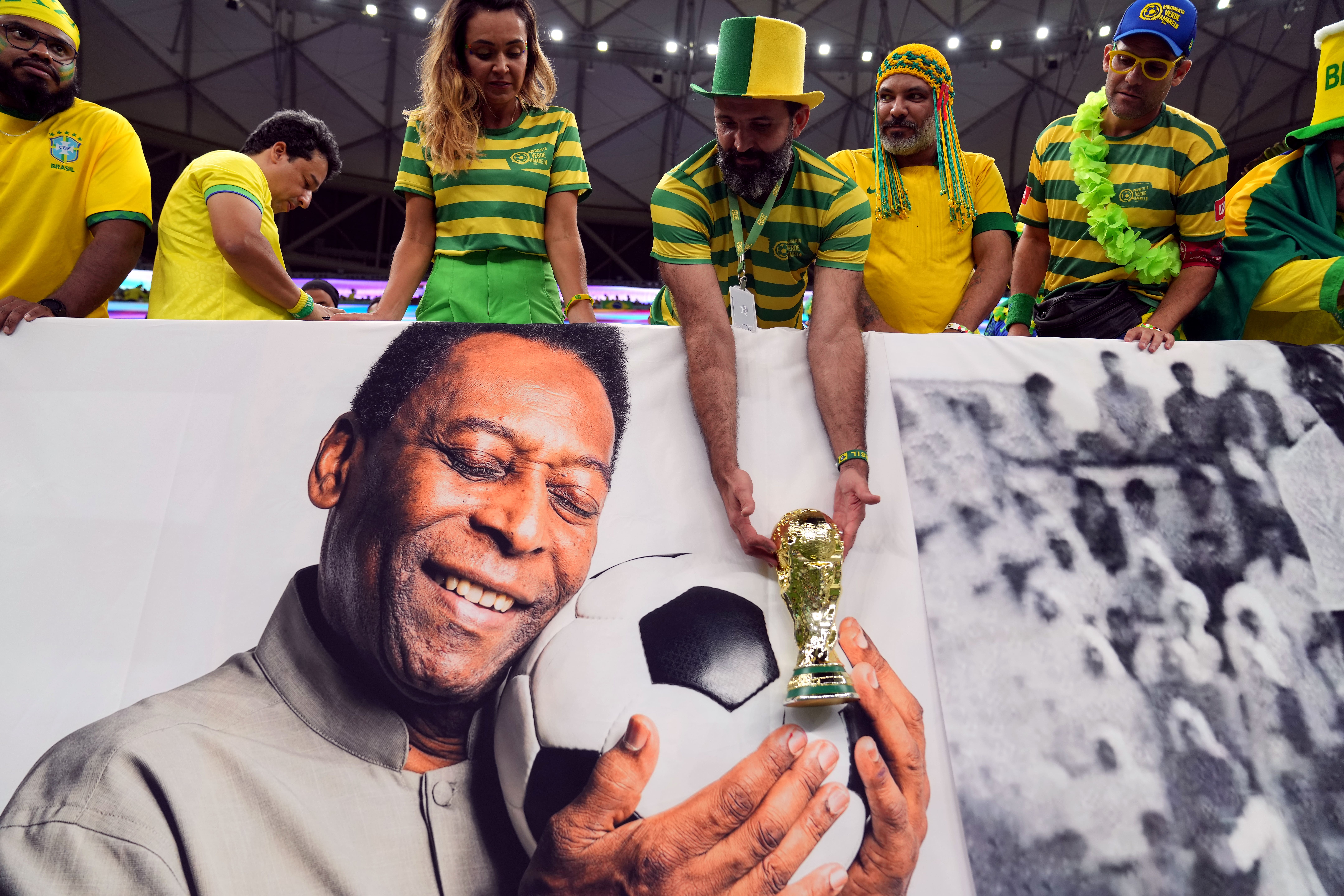 A picture of Pele held up by Brazil fans during a match in Qatar (Peter Byrne/PA)
