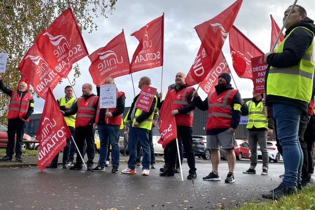 Workers on a picket line outside the Co-op Funeralcare coffin factory in Glasgow (PA)
